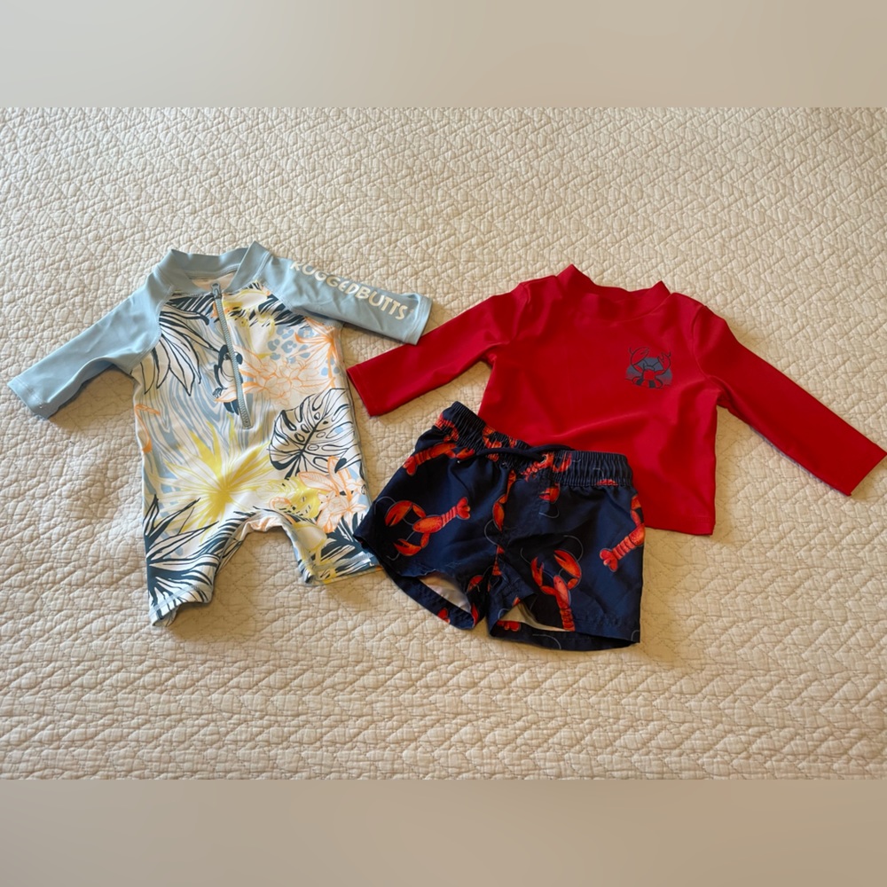 (2) 6-month Swim Suits/Rashguards